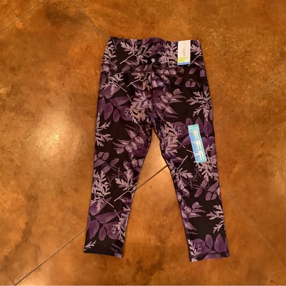 Marika sport tummy control capris. Navy/purple floral. Sz L. NWT - Picture 2 of 4